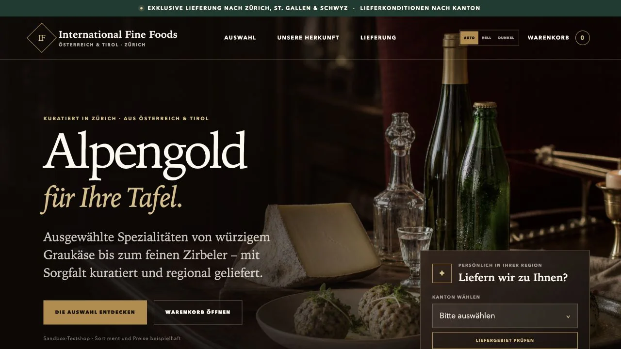 International Fine Foods test shop homepage with the headline Alpengold für Ihre Tafel and a delivery-area checker
